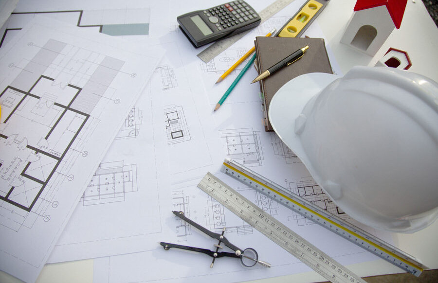 Desk of Architectural working project in construction site,With Desk of Architectural working project in construction site,With drawing equipment concept.