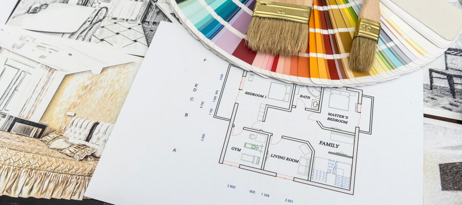 Arcitechture blueprint for renovation home. Color catalog with house sketch at  office desk. Creative workday